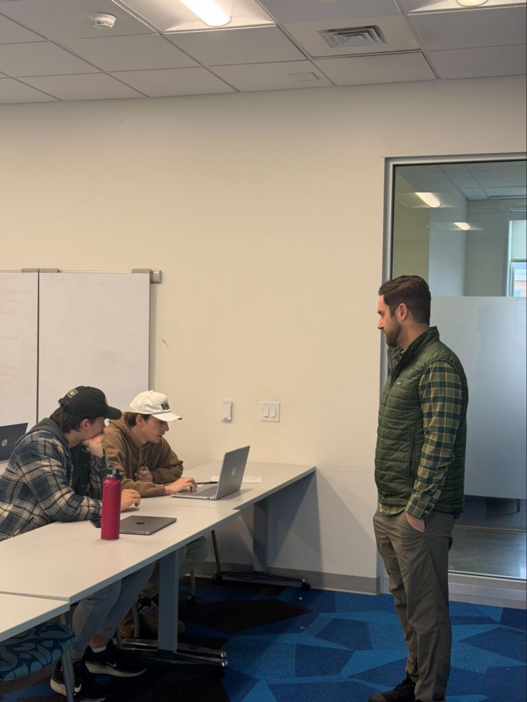 Students and teacher in a classroom discussion