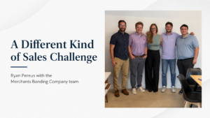 Team photo beside sales presentation slide